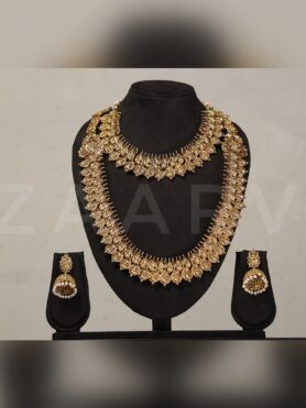 GOLD TONED LAKSHMI COIN NECKLACE AND HARAM COMBO SET