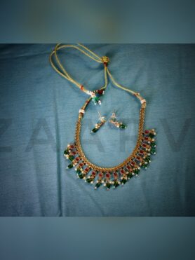 RADIANT GREEN BEADS NECKLACE WITH RUBY ACCENTS